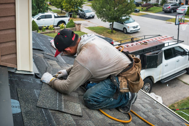Professional Gutter Installation technician working in Chelsea, MA